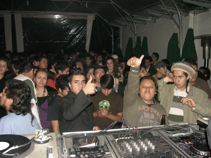 an image of a dj mixing in front of the crowd