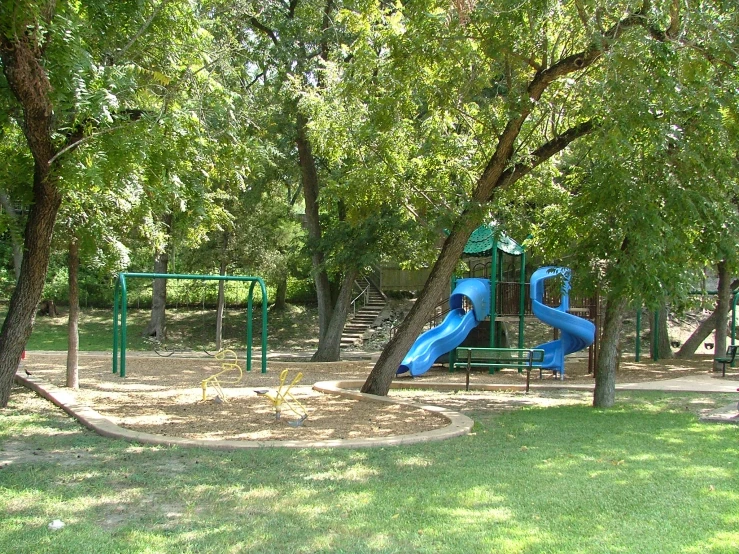 a playground area has many colorful play equipment