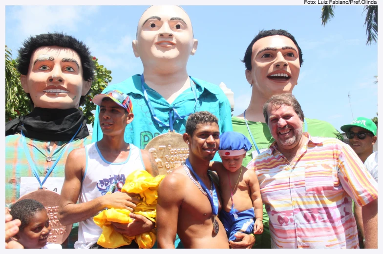 men standing in front of a statue of headless people