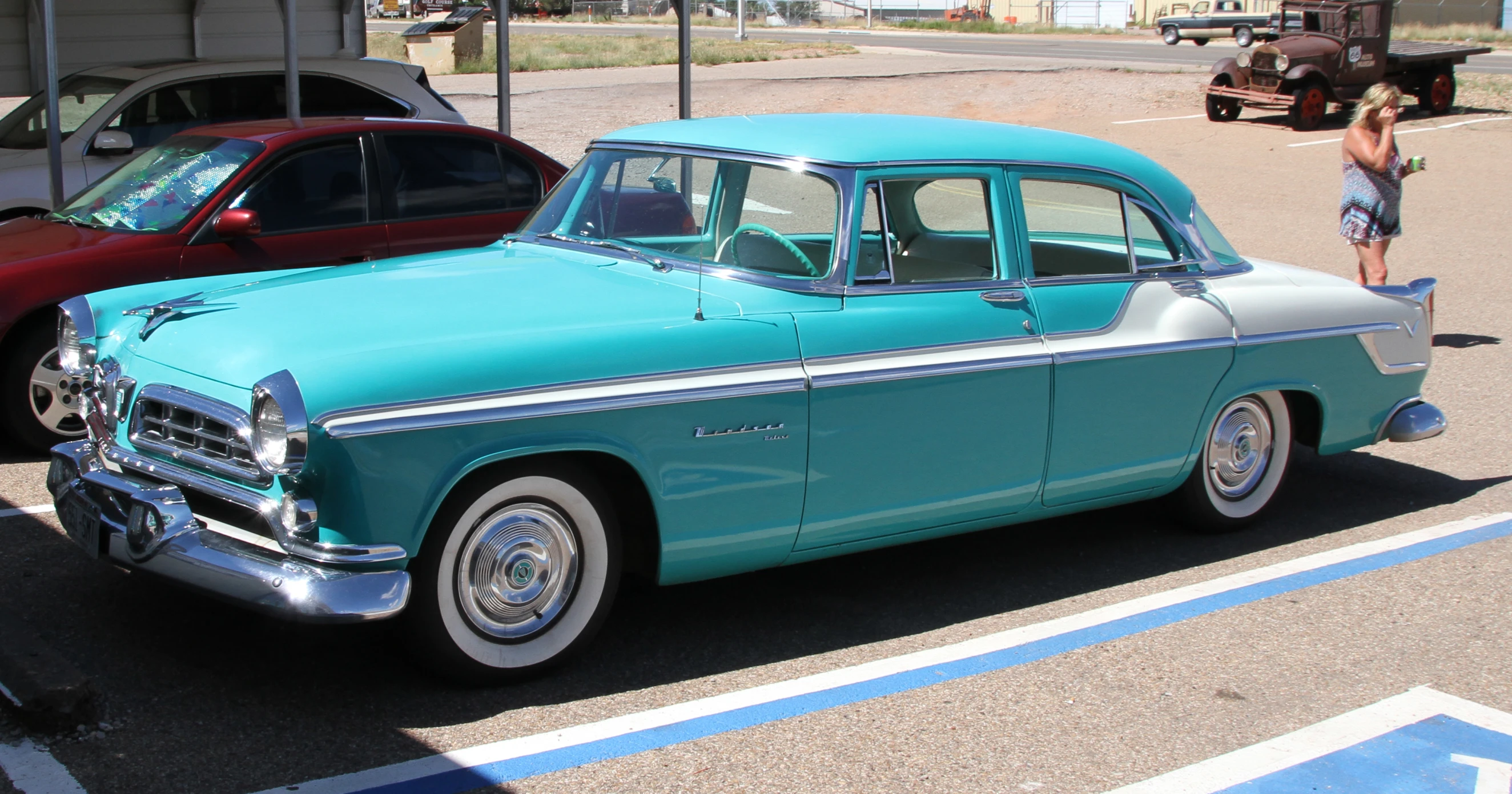 a vintage car that is parked in the lot