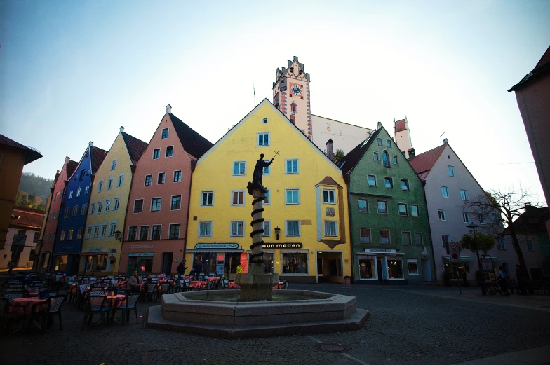 a clock tower towering over a city square