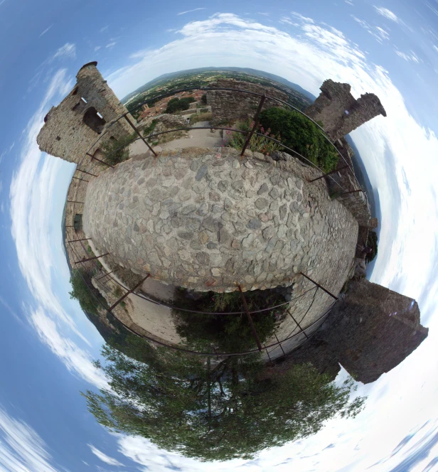 a circular view of an island, with the surrounding land