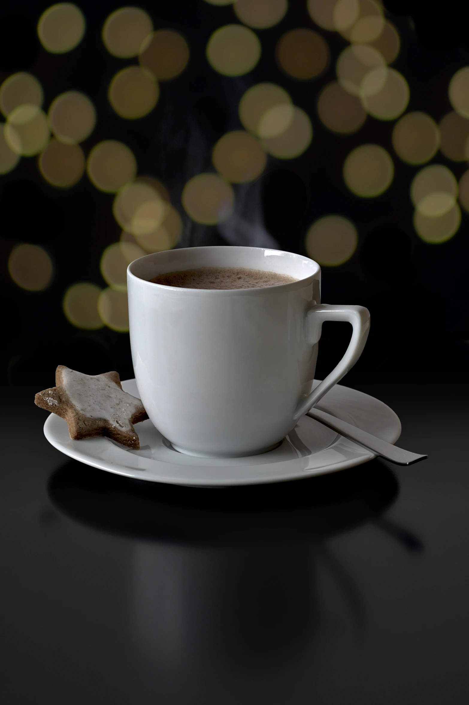 a cup with a beverage in the front sitting on a saucer