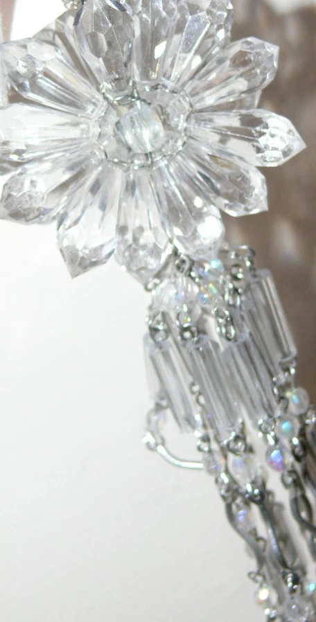 closeup po of the beads on an elegant glass flower ornament