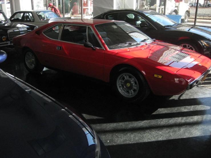 a ferrari on display at an automobile show