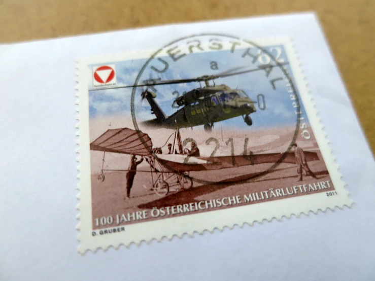 stamp with a small plane flying over