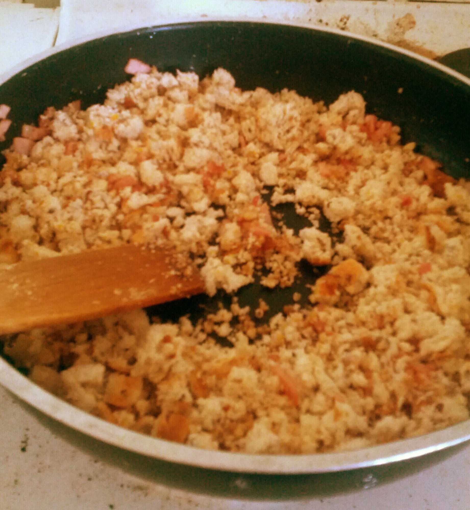 this is food being cooked in a wok on the stove