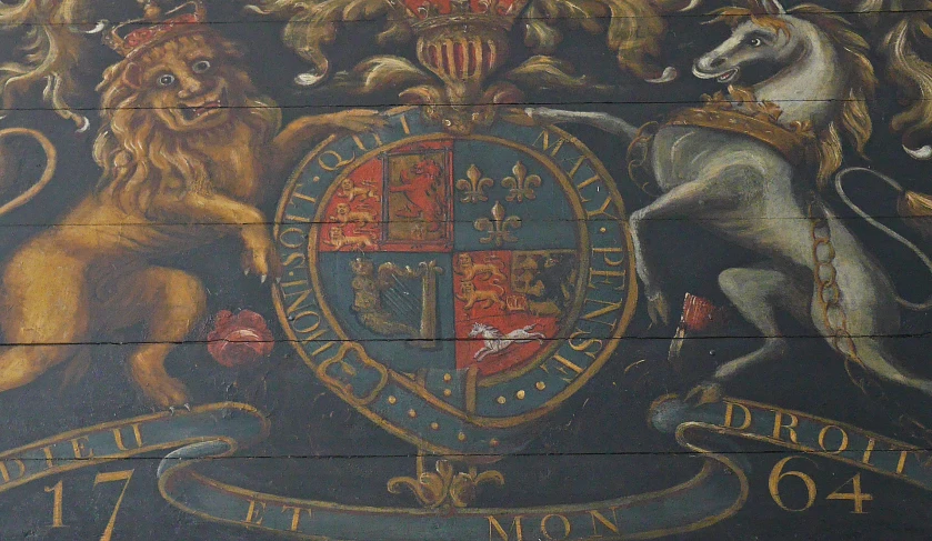 a mural on a wall depicting the knights and lions