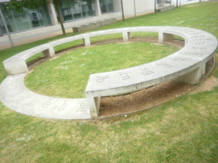 the large stone bench has numbers and numbers carved into it