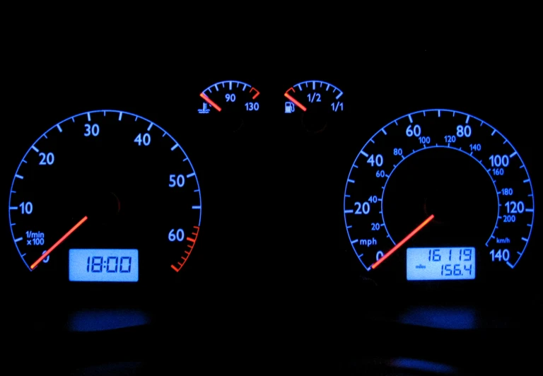 a dashboard s of a car at night