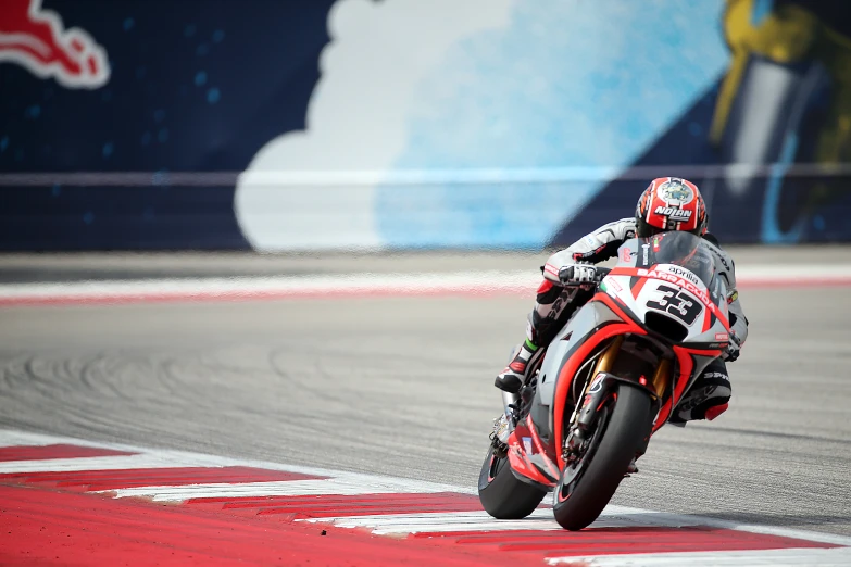 motorcycle racer racing down a track during a race