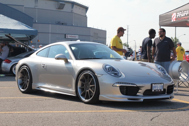 a porsche 911 sports car is parked on the street
