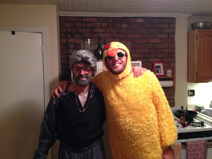 two men dressed in yellow with funny glasses