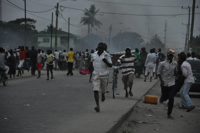 an image of men walking down the street carrying suitcases