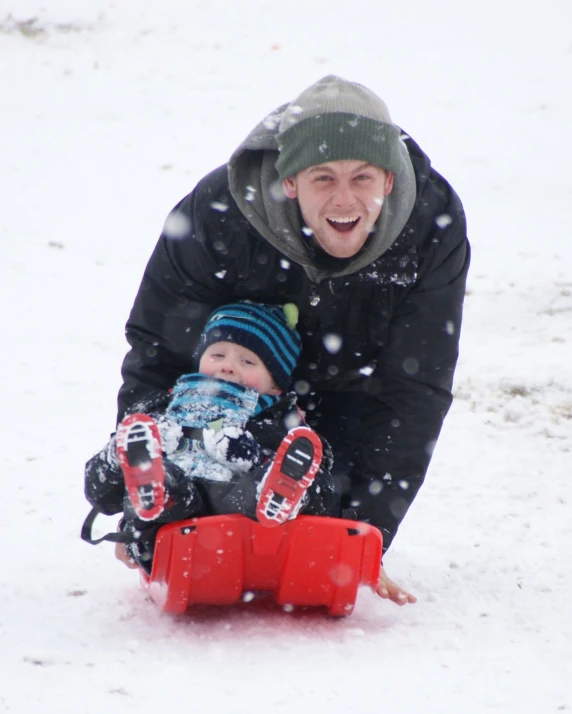 a person with a snowboard is playing in the snow