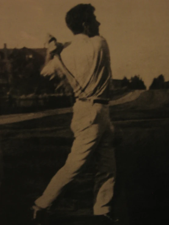 an old po of a baseball player about to swing the bat