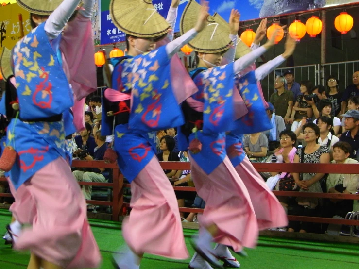 three women in oriental style clothing performing dances