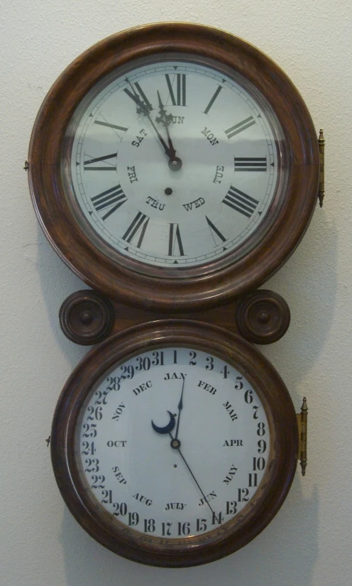 a large clock mounted to the side of a wall