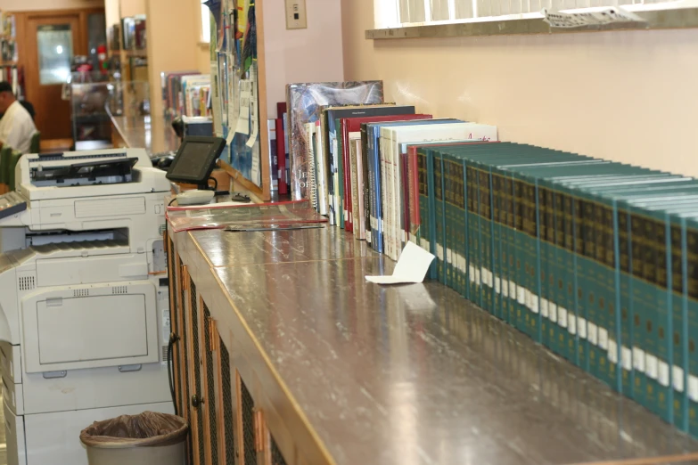 stacks of books sitting on top of a counter