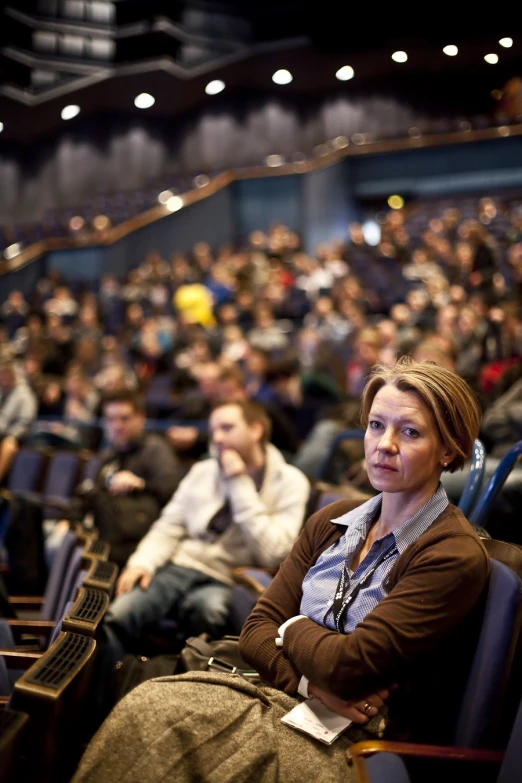 the crowd is waiting for the lecture to begin