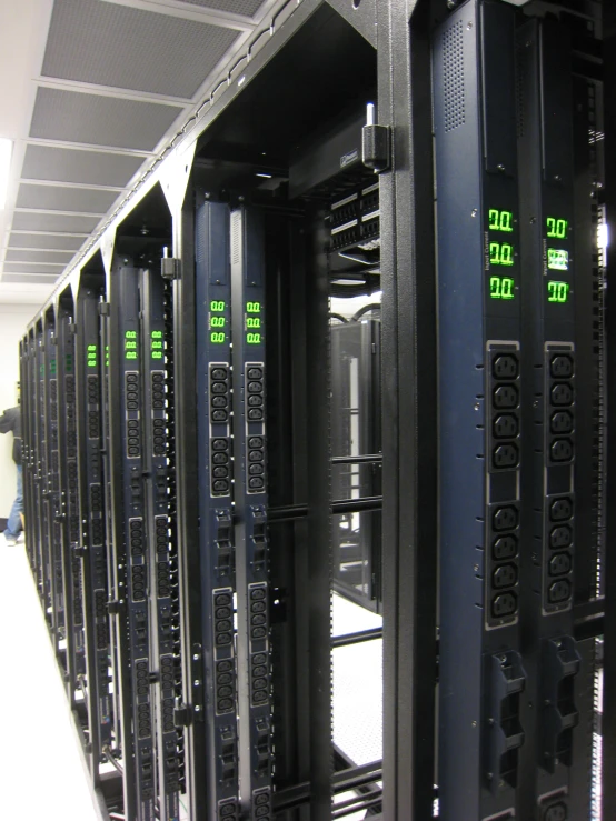 rows of computer servers in an office room