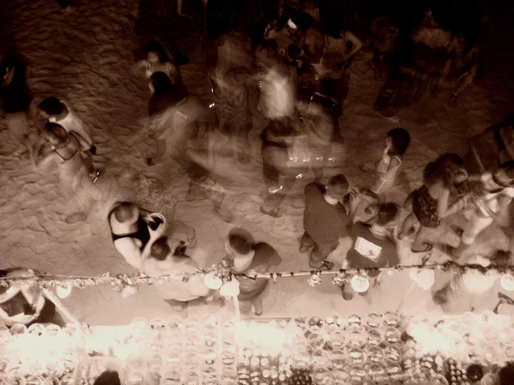 a group of people gather around and drink in a bar