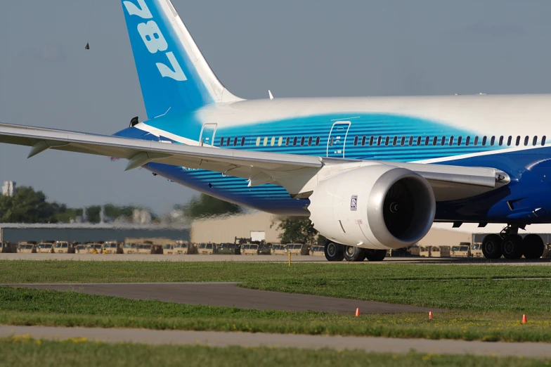 the large airplane is painted bright blue