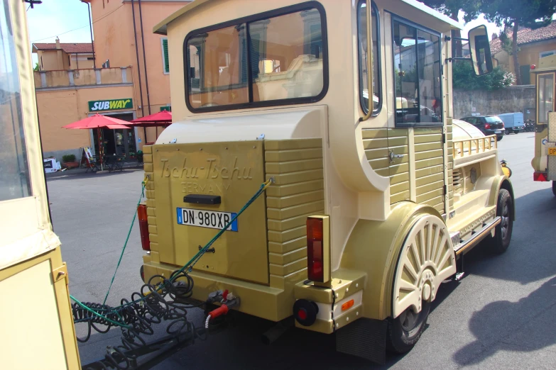 a large yellow carriage that is parked on the street