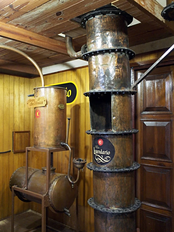 the interior of an empty storage room has rusty metal pots in it