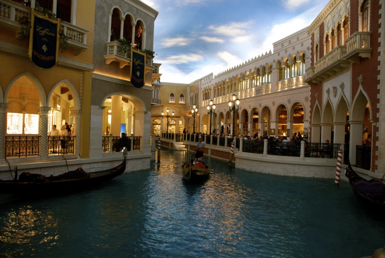 a gondola on the water in a shopping area