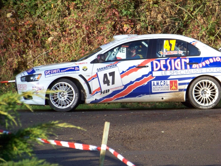 the car was making a turn while racing on a road