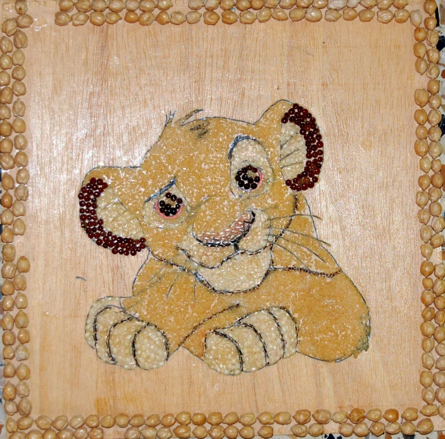 a brown framed painting of a lion