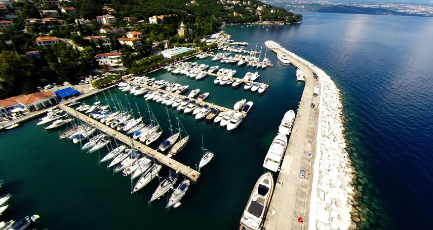 an overhead view shows boats on the water and at dock