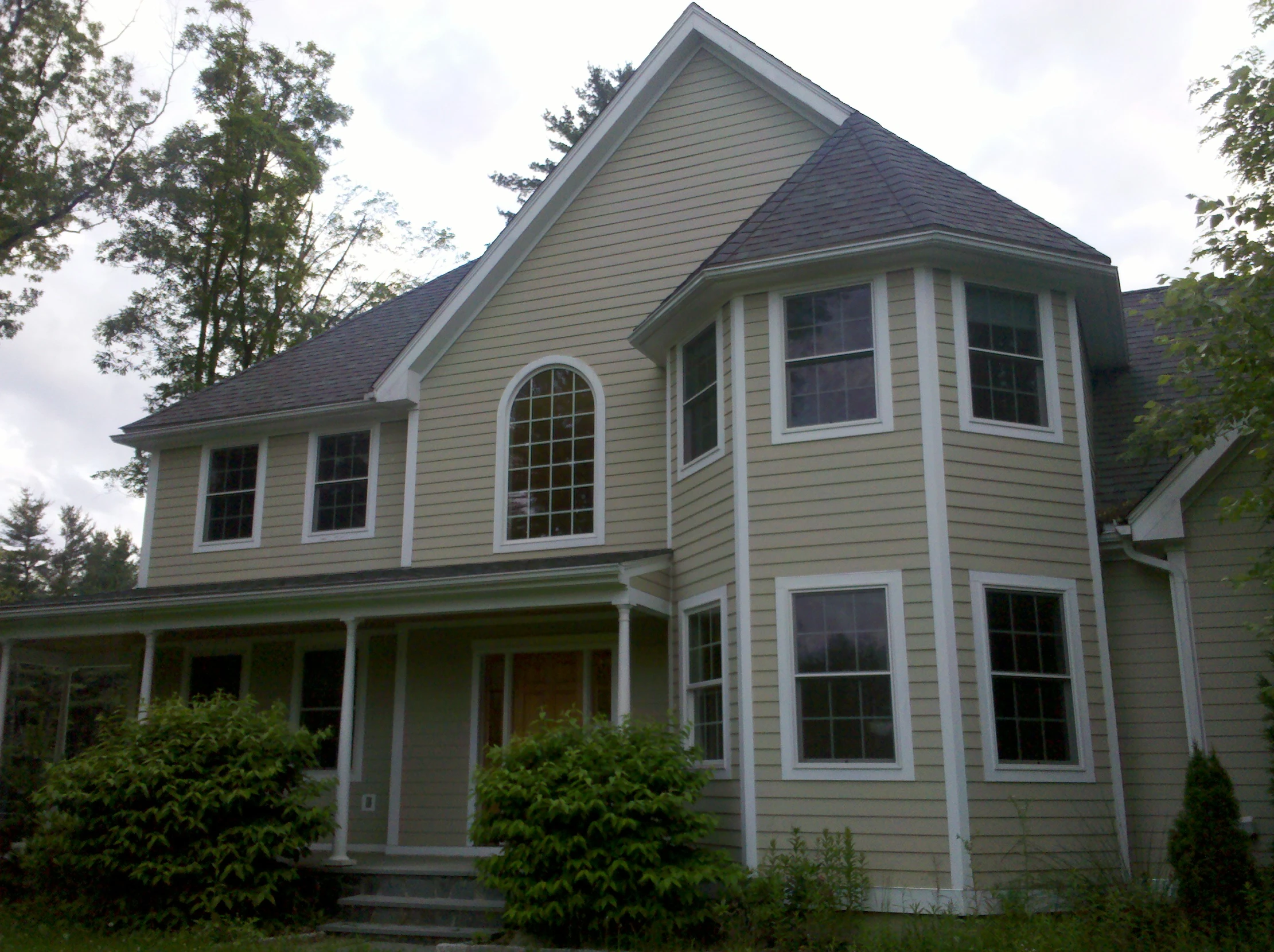 a large beige home in the daytime