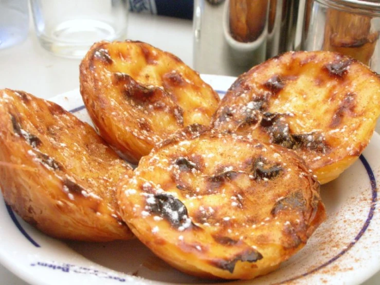 a white plate holding some cooked pastries