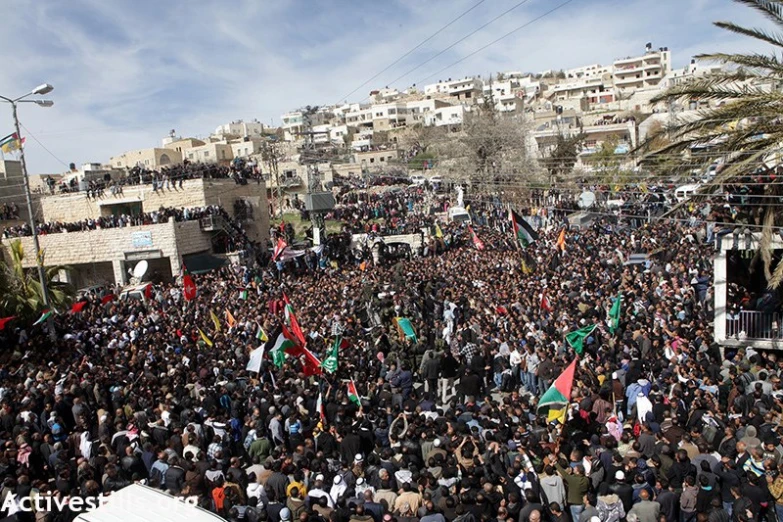 a huge crowd is gathered outside and celeting a large rally