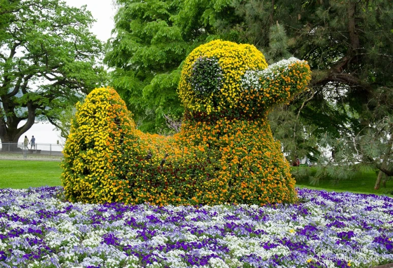 a flower sculpture in the shape of a dog