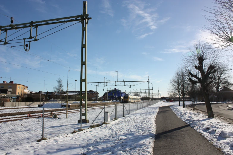 a train is coming down some tracks in the snow