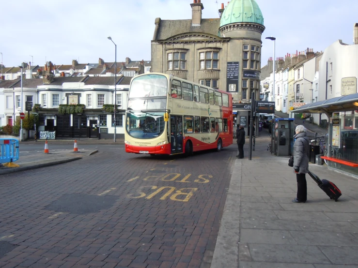 there is a double decker bus on the street