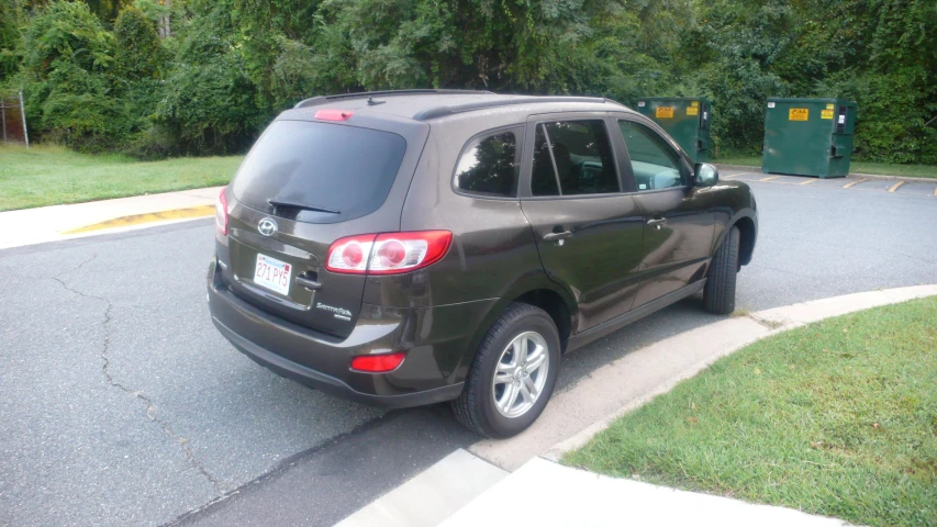 a car parked in a parking space by a parking meter