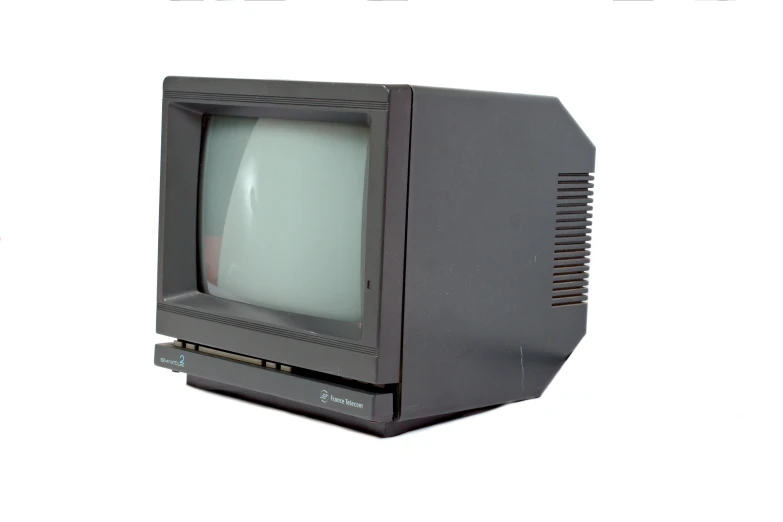 an old black television is sitting on a desk