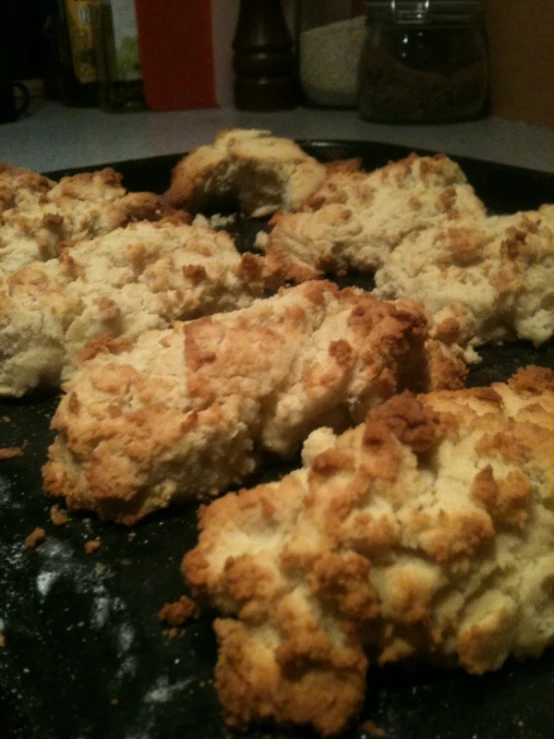 a fried and uncut cookie sits on a metal set