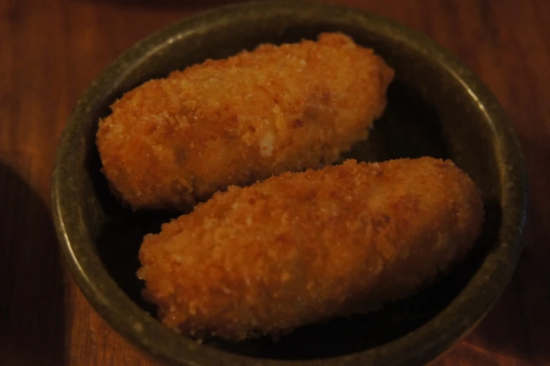 two chicken tenderises in a small metal bowl