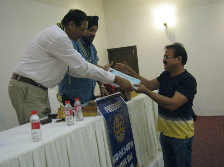 three men giving each other a hand shake