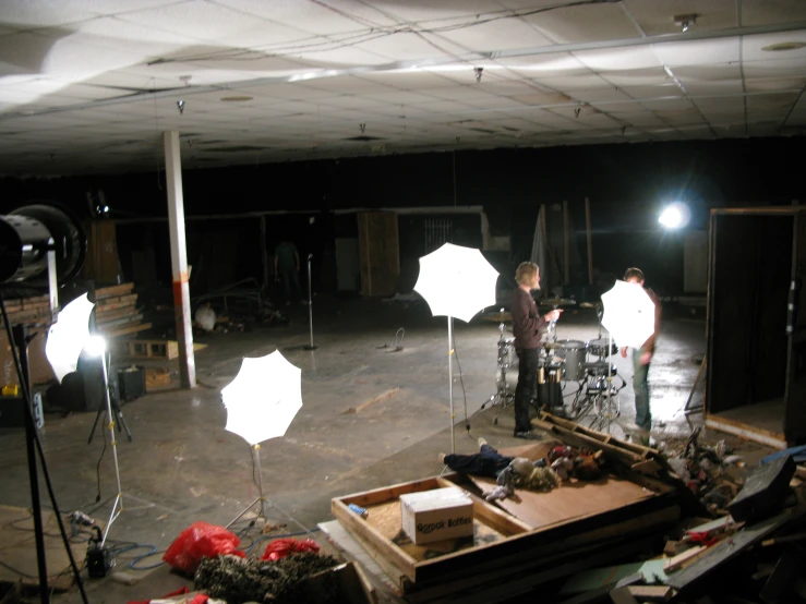 two people in a building that has lights behind them