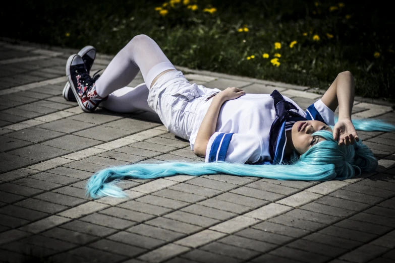 girl with blue hair lying on the ground wearing an american flag outfit