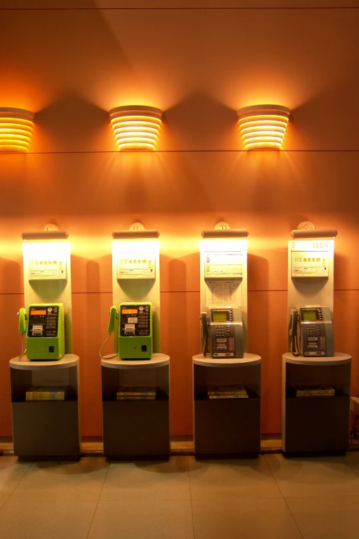 several atm machines sit in a row next to each other