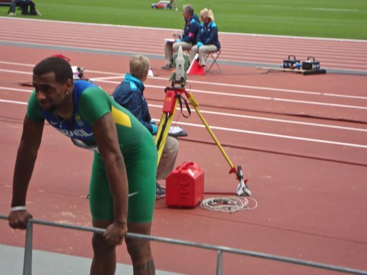 a man that is standing up with a pole