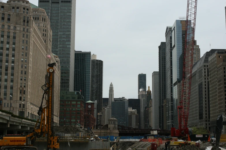 a crane next to a very tall building