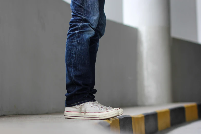 a close - up of a man's shoes on an obstacle line